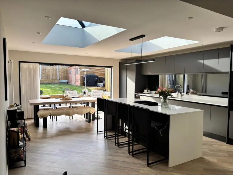 Wix orangery interior with kitchen island, twin roof lanterns and bifold doors