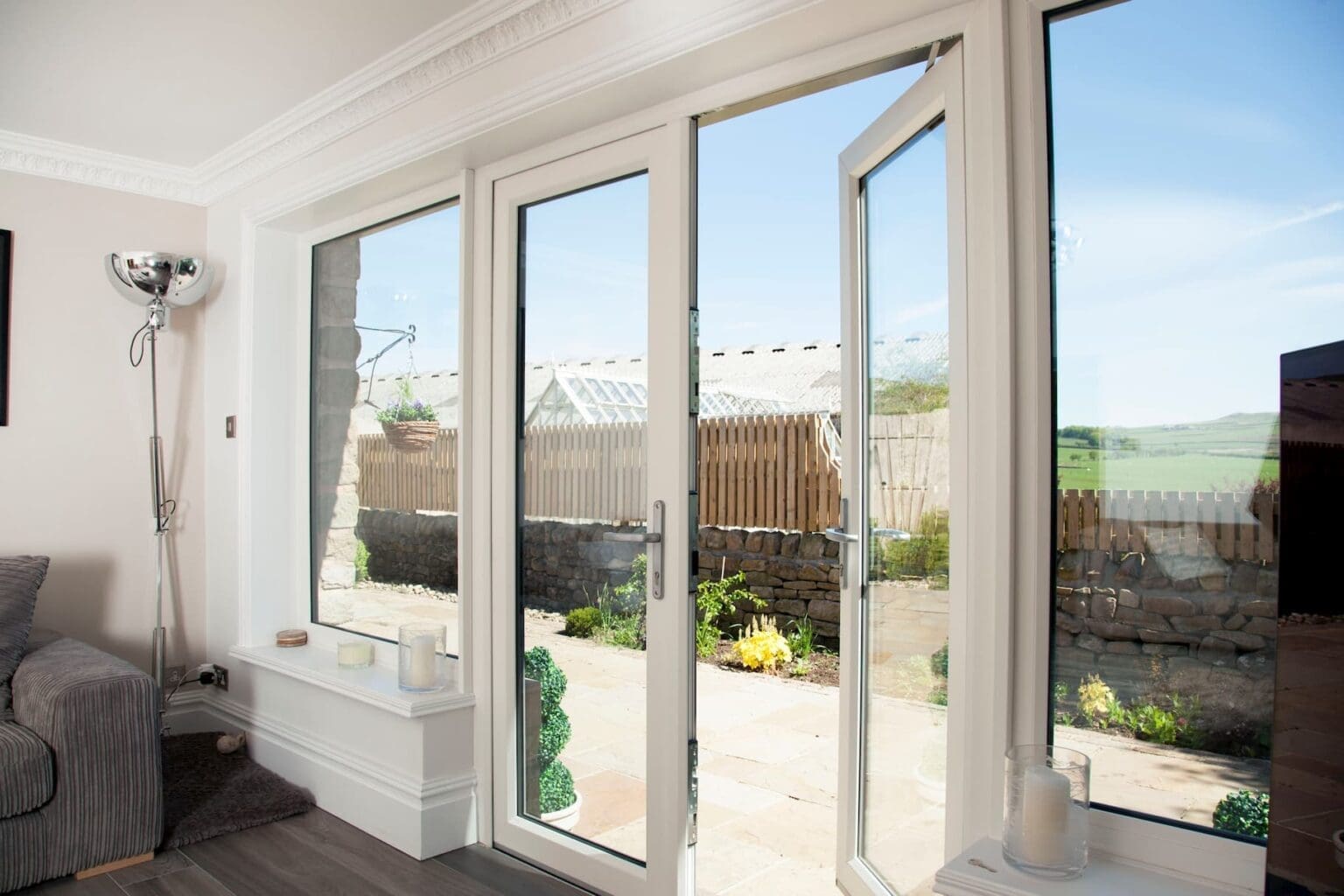 White uPVC French doors viewed from a bright living room