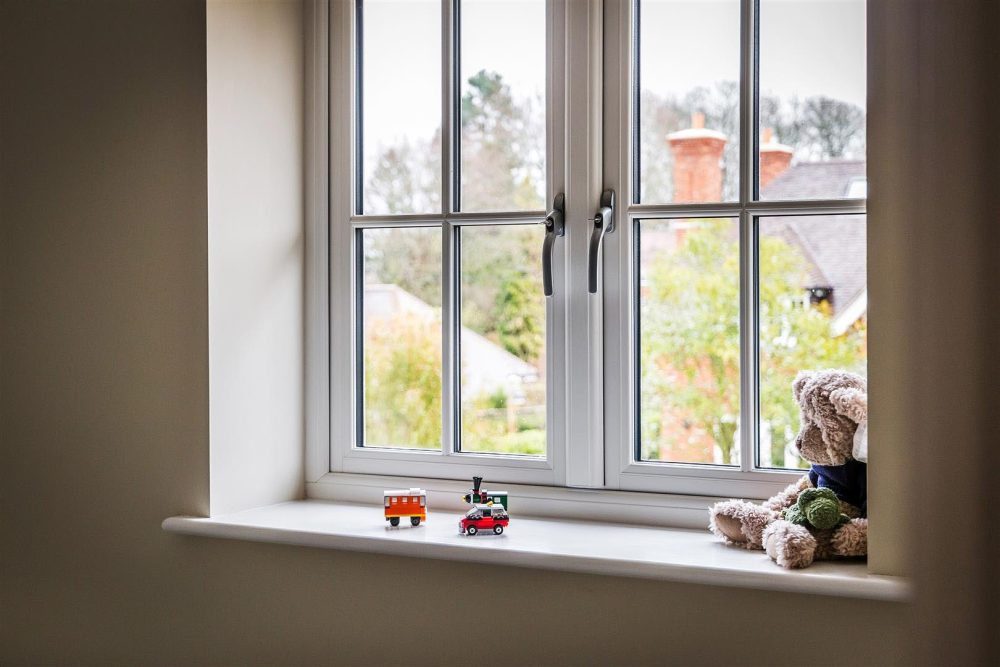 Timber-effect flush casement window with traditional detailing