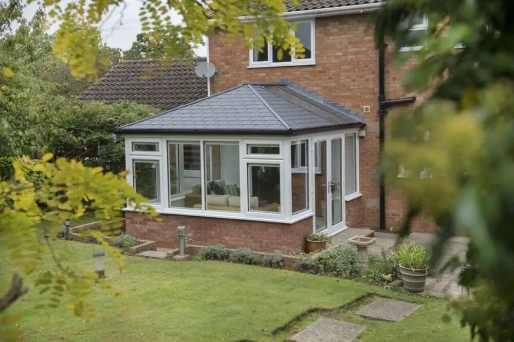 Ultraroof tiled roof on a conservatory adjoining a brick home