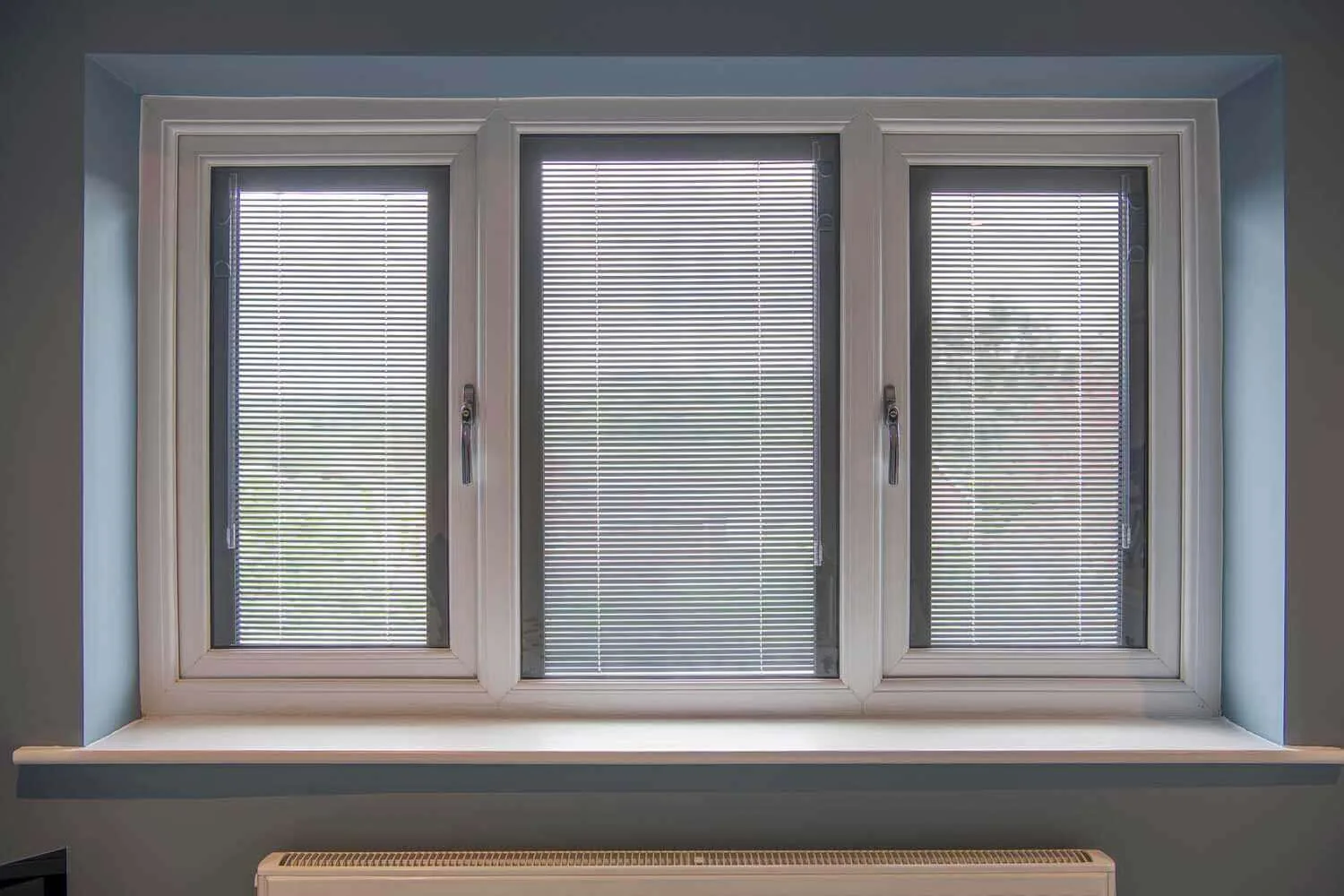 Three-part window with integral Venetian blinds